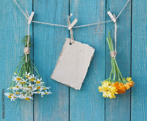 Two bouquets of camomile and calendula and sheet of paper for me