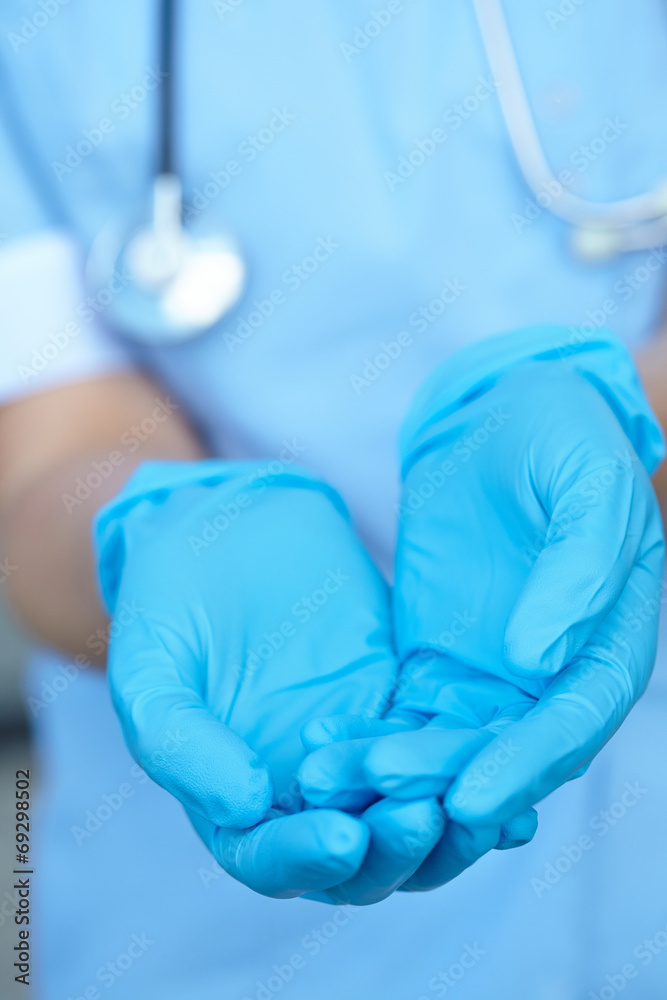 woman doctor in medical gloves woman doctor in medical gloves