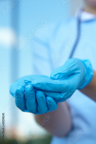 woman doctor in medical gloves