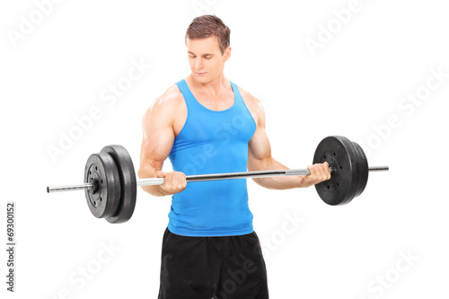 Muscular bodybuilder lifting a barbell
