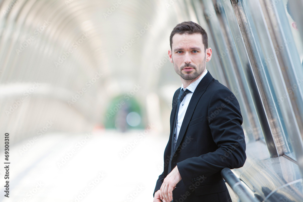 Portrait of an attractive businessman in a building Portrait of an attractive businessman in a building