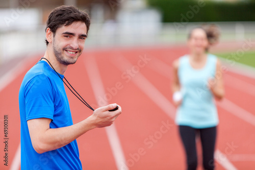 Konstfotografi Sport coach training a young attractive woman