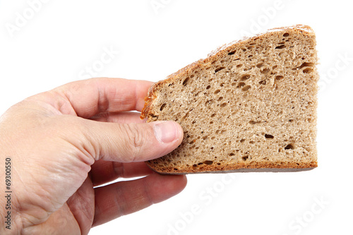 Bread slice in hand on white background.
