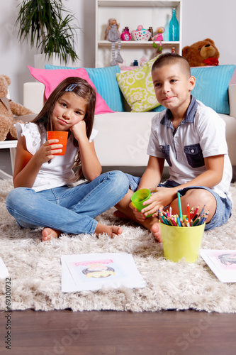 Twin borther and sister spend time at home photo