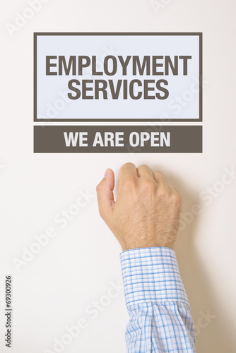 Businessman knocking on employment services door
