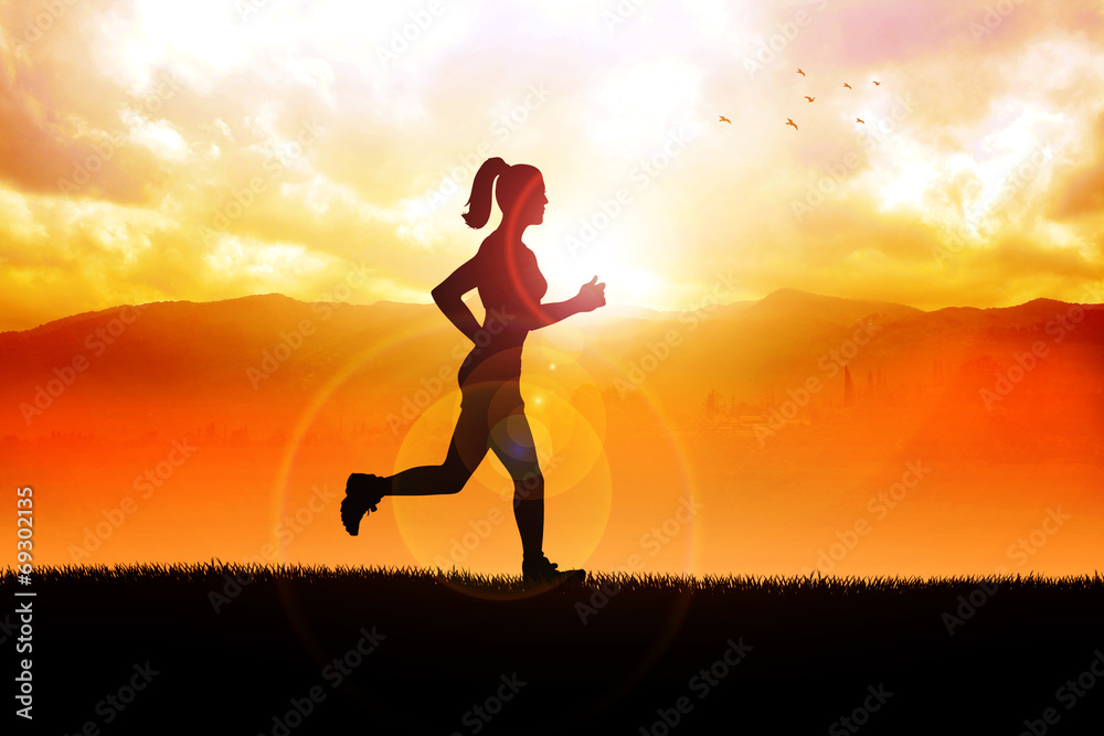 Silhouette of a woman jogging in the beautiful landscape