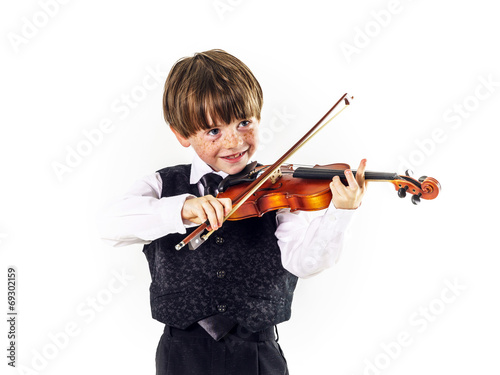 Red-haired preschooler boy with violin photo