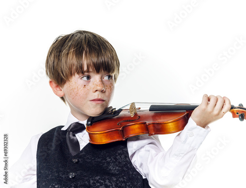 Red-haired preschooler boy with violin photo