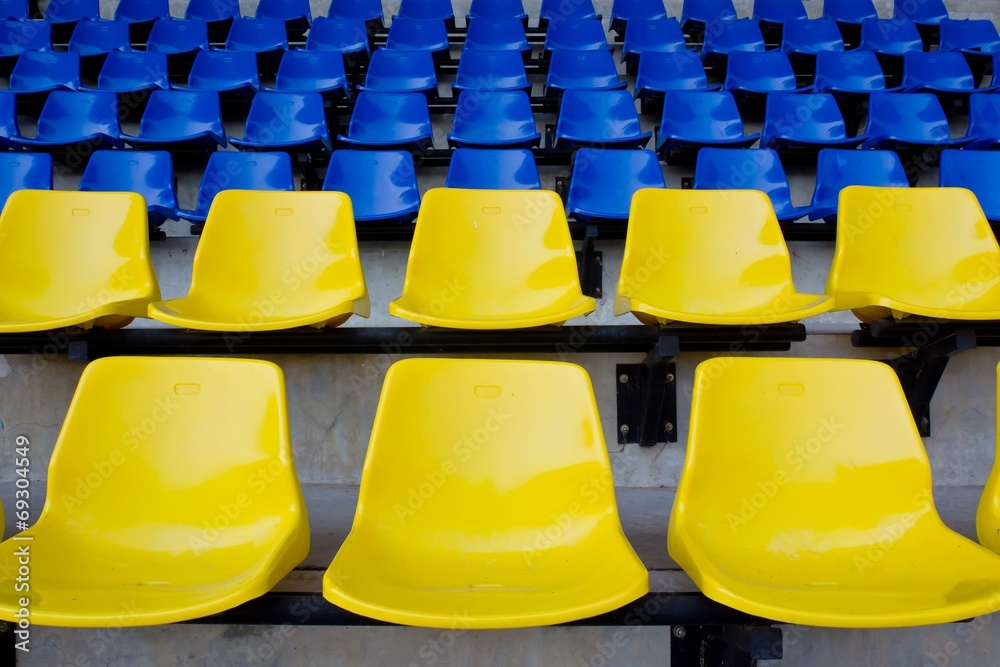 Naklejka premium Blue, Yellow seat rows in stedium