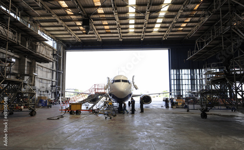 Airplane in hangar prepared for overhaul