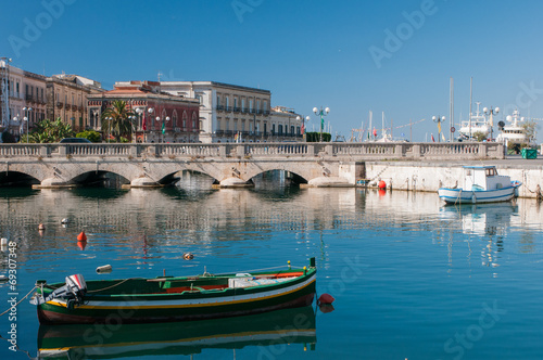 View of Umberto I bridge in Siracuse and fishing boats © siculodoc