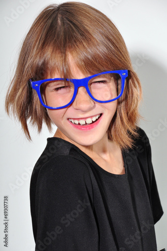 kid with glasses having fun photo