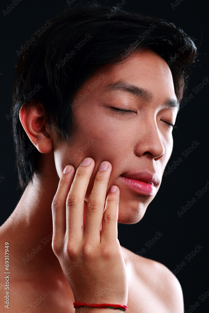Closeup portrait of a Young Asian man with toothache Closeup portrait of a Young Asian man with toothache