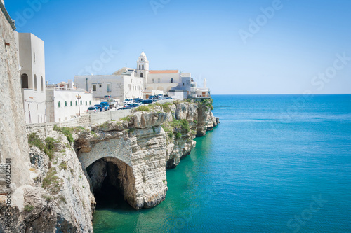 church in front of adriatic sea in the Vieste Italy photo