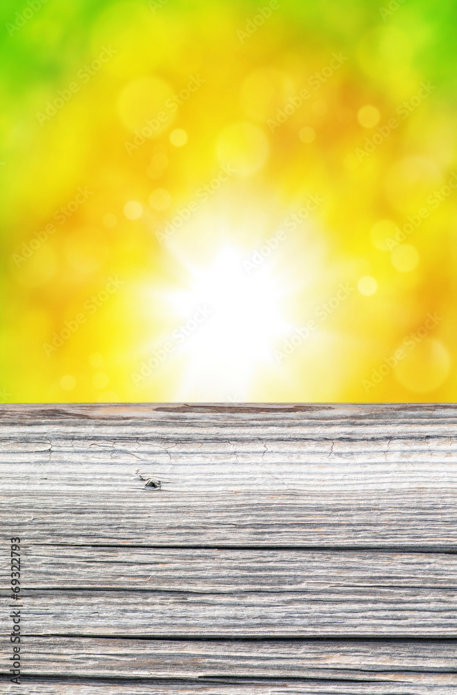 Empty rustic wooden board with abstract summer background Empty rustic wooden board with abstract summer background