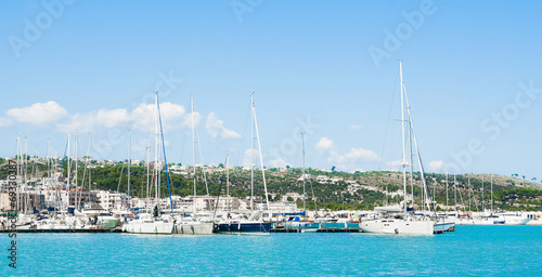 boats in the sea port under beautiful sunny day © donfiore