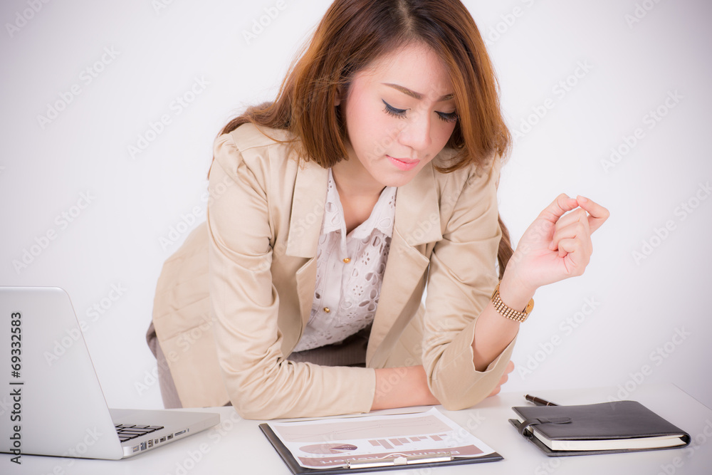 Portrait of a young business woman using laptop at office Portrait of a young business woman using laptop at office