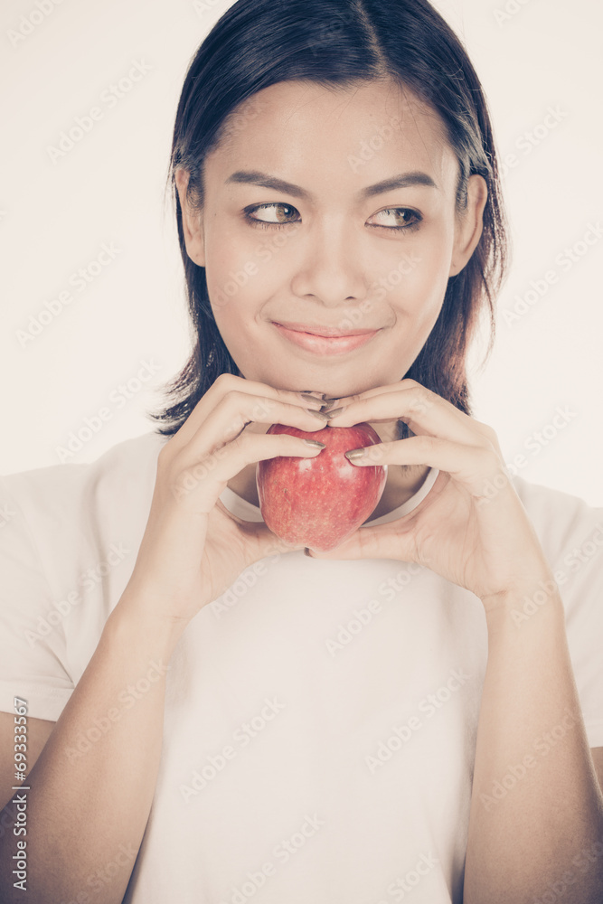 Smiling woman with apple isolated on white Smiling woman with apple isolated on white