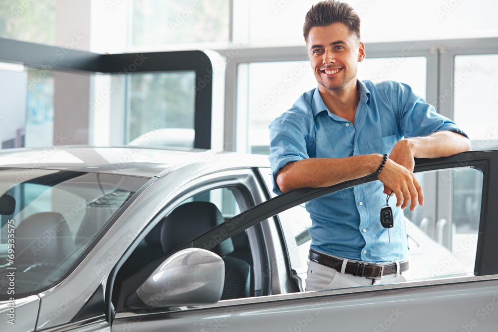 Car Showroom. Happy Man With Keys To The Car Of His Dreams. Car Showroom. Happy Man With Keys To The Car Of His Dreams.