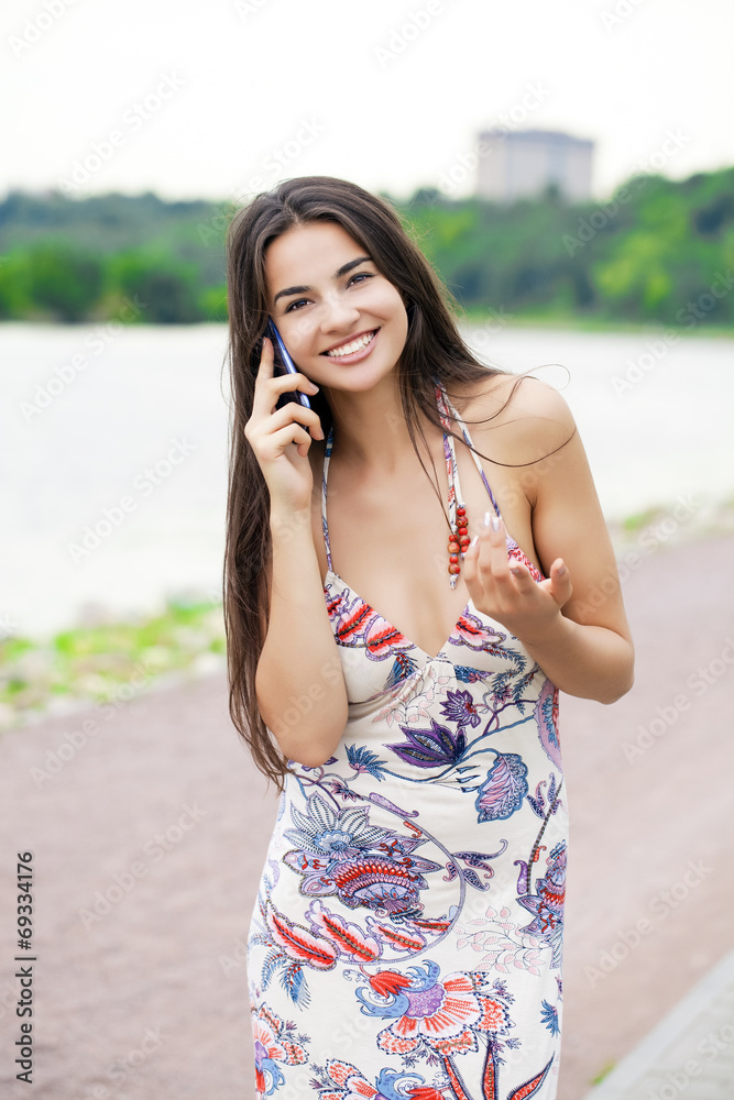 Happy beautiful girl calling by phone Happy beautiful girl calling by phone