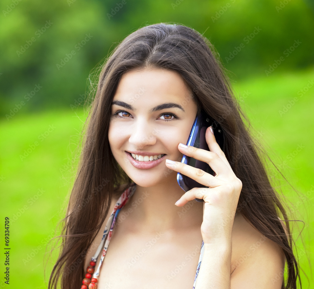Happy beautiful girl calling by phone Happy beautiful girl calling by phone