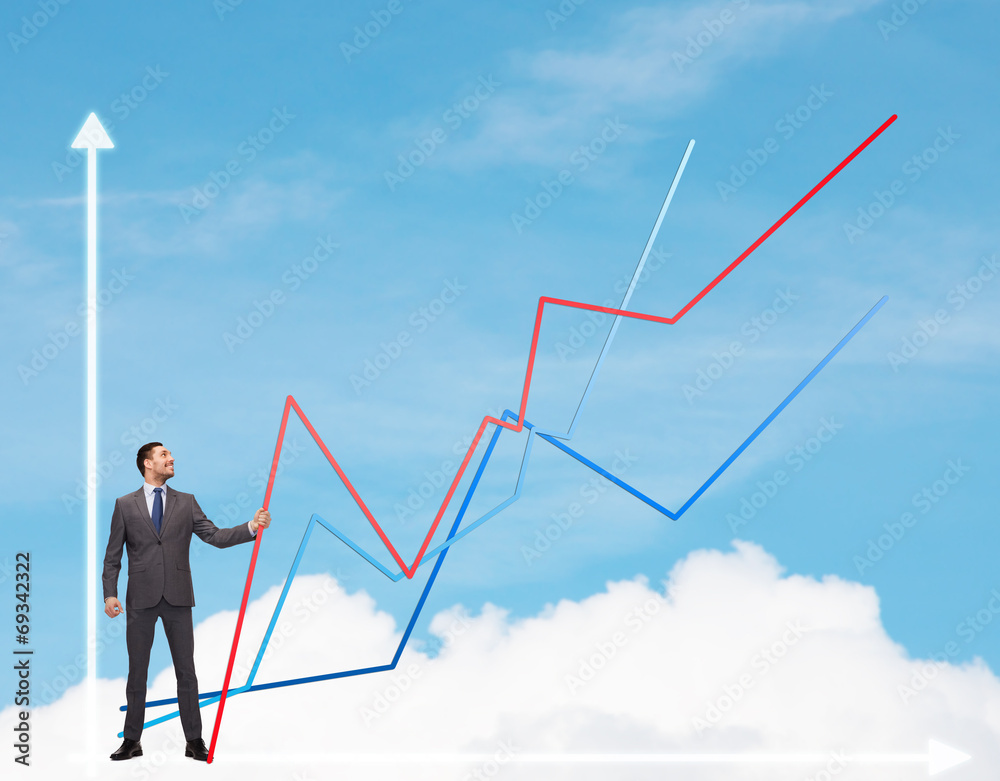 smiling man holding graph line smiling man holding graph line