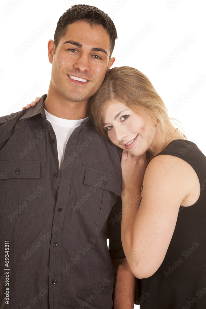 couple dark outfits her head on his shoulder couple dark outfits her head on his shoulder