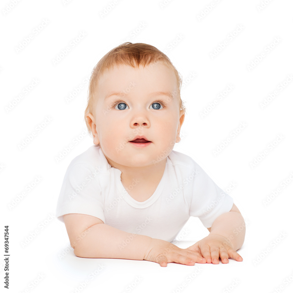 curious baby lying on floor and looking up curious baby lying on floor and looking up