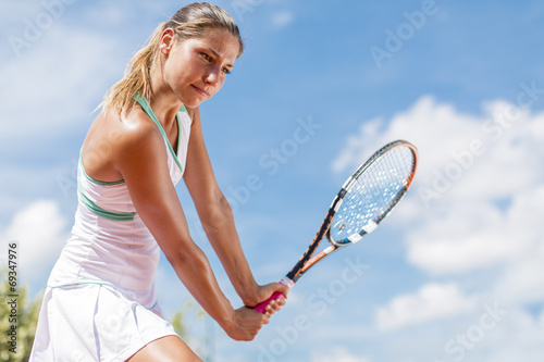 Young woman playing tennis
