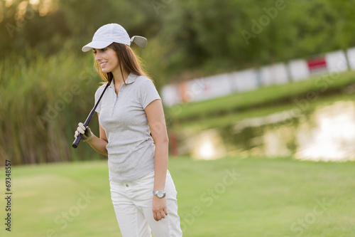 Young woman playing golf