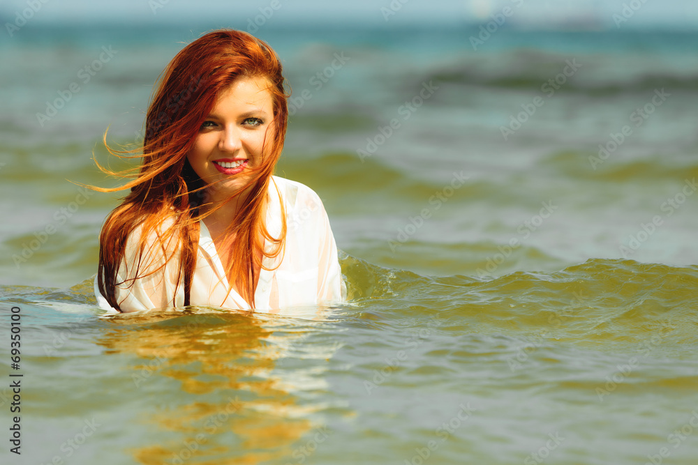 Vacation. Girl in water having fun on the sea.