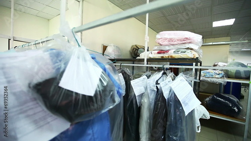 Rack with clean clothes at dry cleaners