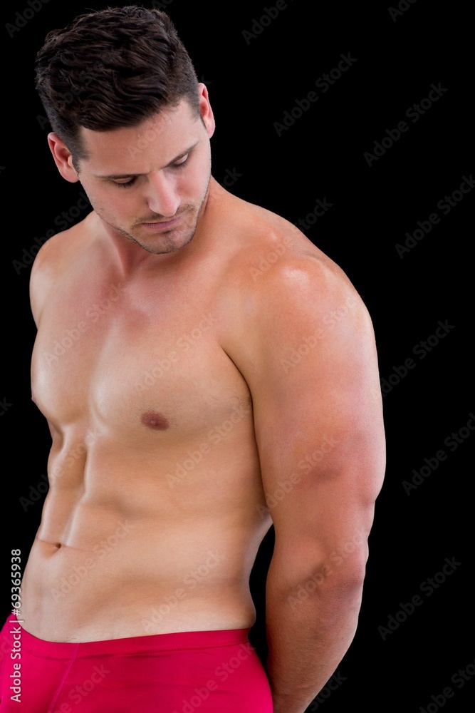 Side view of a shirtless muscular man