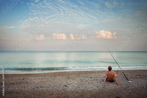 A fisherman on the beach in the morning
