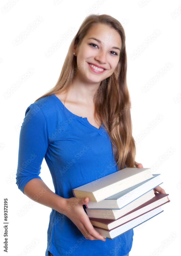 Studentin bereitet sich mit Fachliteratur auf das Studium vor Studentin bereitet sich mit Fachliteratur auf das Studium vor