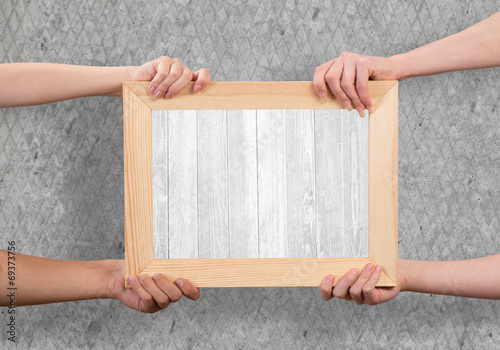 Hands holding frame