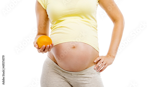 Pregnant woman with orange