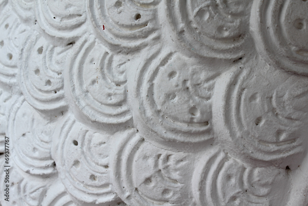 Closeup of concrete naga snake skin.