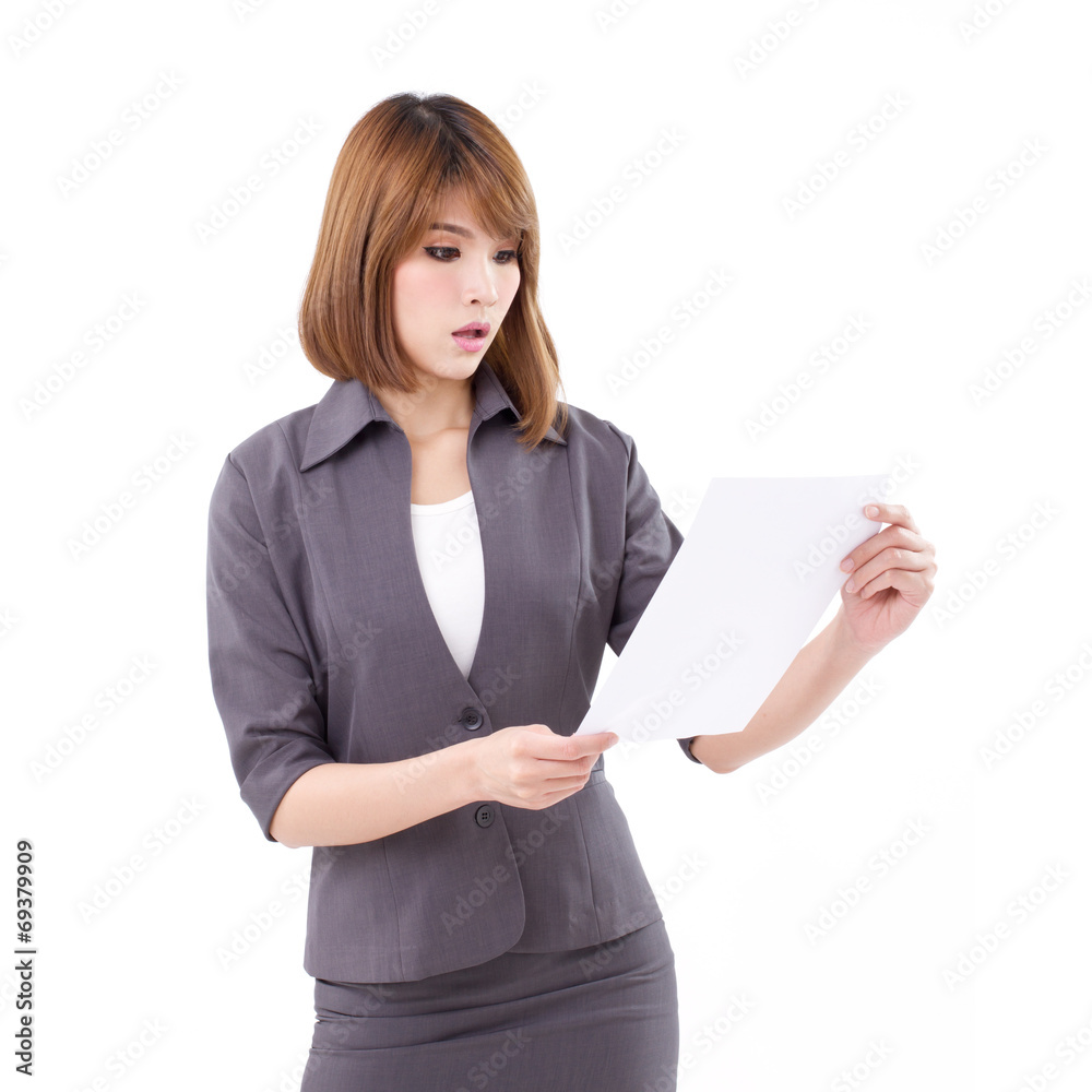 surprised business woman looking, reading the document surprised business woman looking, reading the document