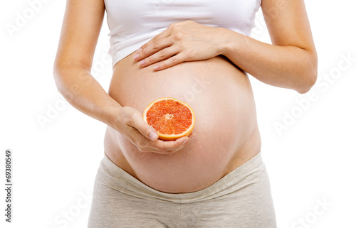 Pregnant woman with grapefruit