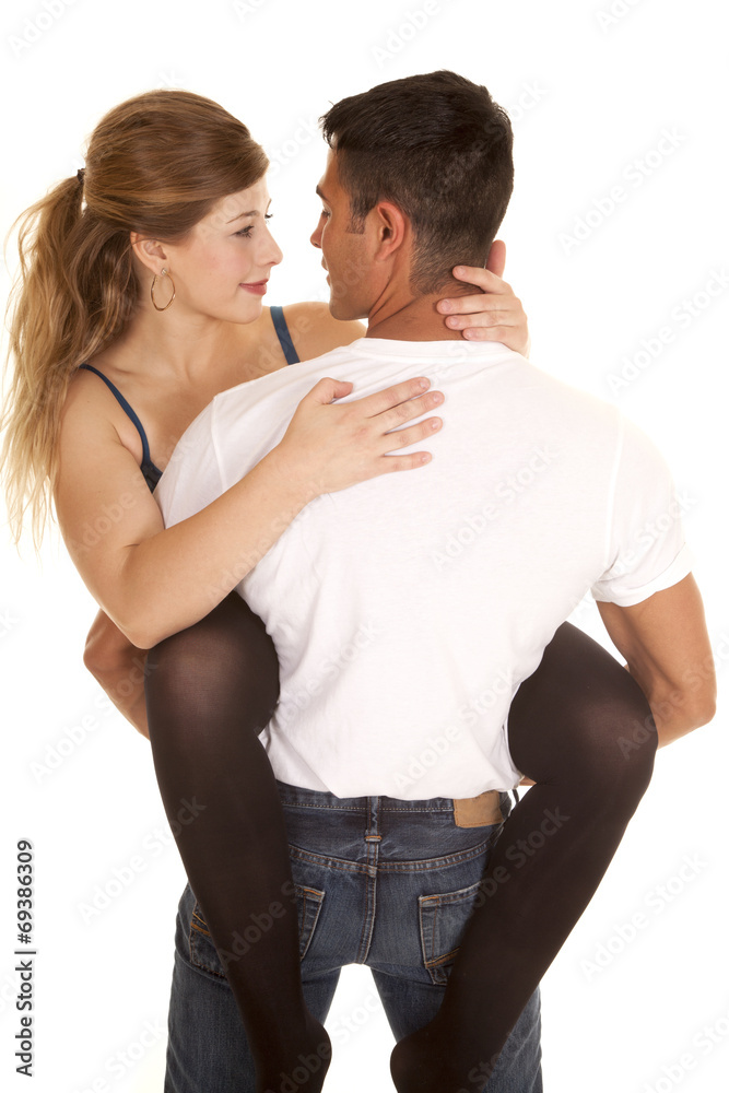 woman legs around man holding her look at each other woman legs around man holding her look at each other