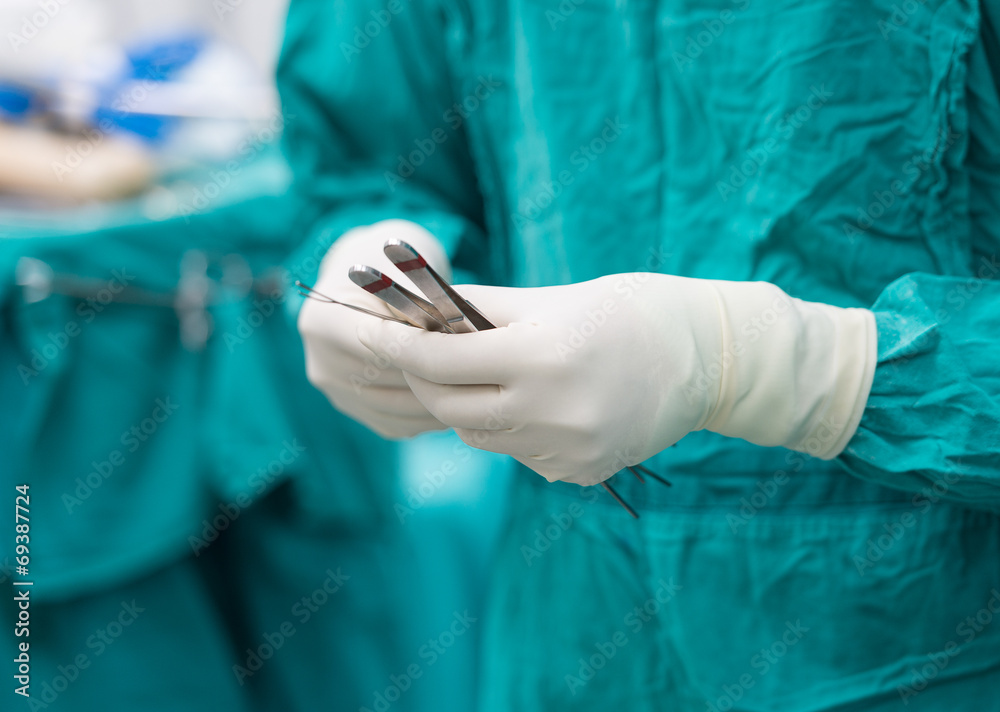scrub nurse preparing tools for operation scrub nurse preparing tools for operation