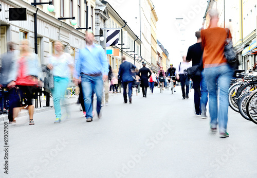 Photography City street with motion blurred pedestrians and bicycles