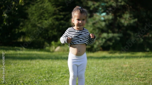 Beautiful child and green trees