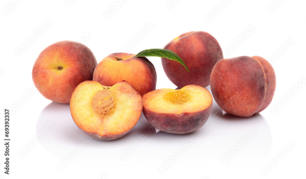 Many peaches with leaf isolated on white