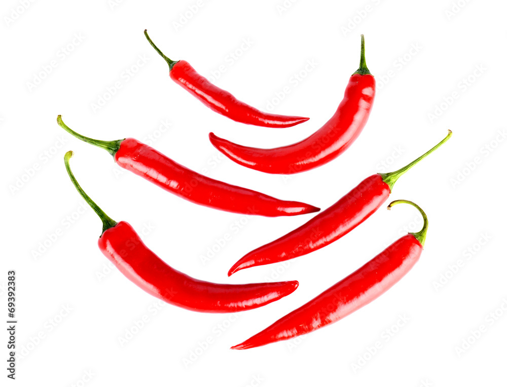 Top view of symetrical red peppers isolated white background