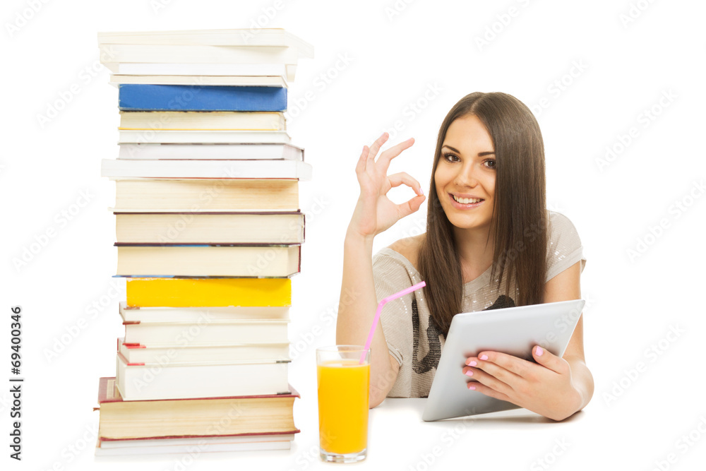 Happy teenage girl with books and tablet gesturing okay