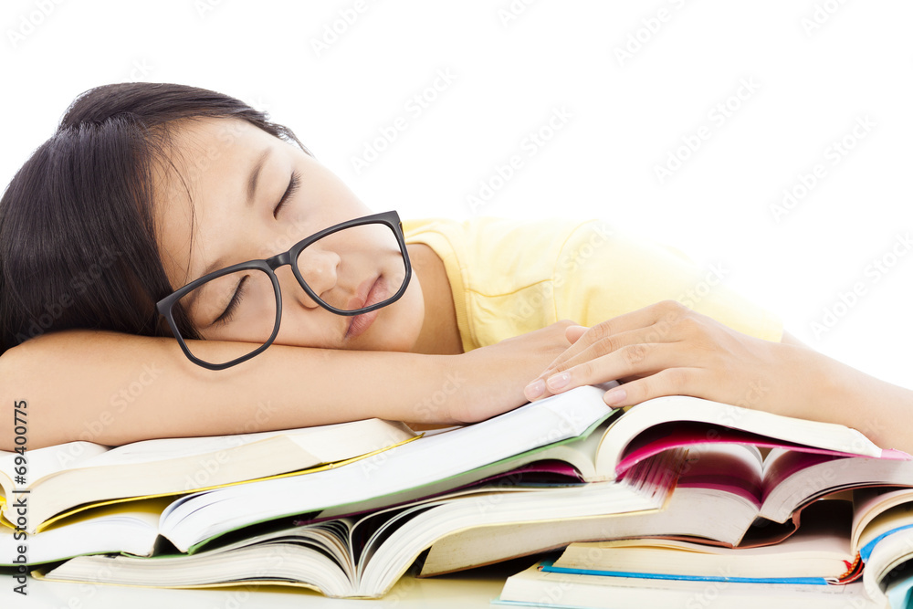 tired student girl with glasses sleeping on the books tired student girl with glasses sleeping on the books