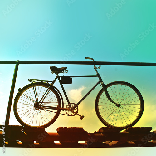 Retro bike on an old wooden bridge.