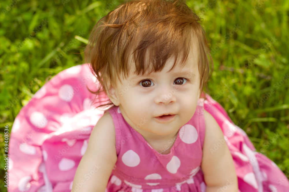 Beautiful baby girl on nature in garden Beautiful baby girl on nature in garden